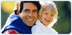 Father and daughter smiling as they leave the dentist office.